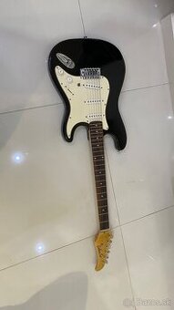 Predam elektrickú gitaru.