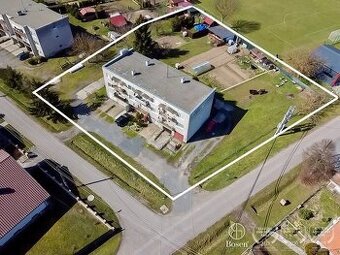 4 izbový byt s balkónom, garážou a záhradou.