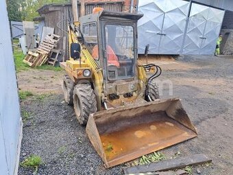 Kúpim unc, šmykový nakladač