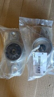 Zadný držiak tlmiča