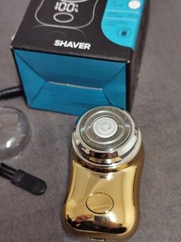 Cestovny nabijatelny holiaci strojcek