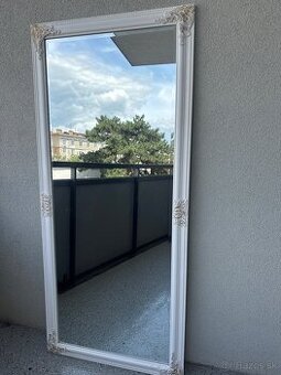 white mirror with gold details