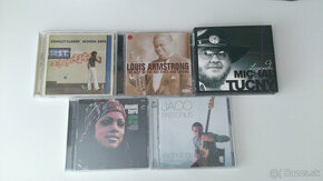 rôzne CD (Tučný, Pastorius, Clarke, Byrd, Armstrong)