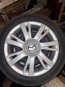 Mazda letne pneumatiky s diskami a puklicami