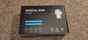 Masazna pistol so 4 nastavcami
