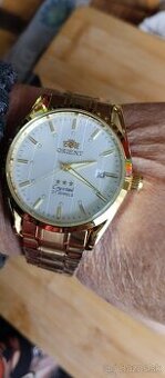 automatické hodinky ORIENT s datem zlaté,nové,s krabičkou