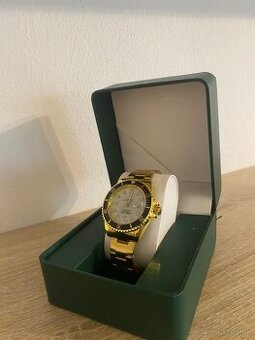 Rolex Submariner - yellow gold, white dial
