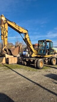 Zeppelin ZM 100 kolesovy bager