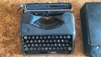 starožitní písací stroj Hermes Baby