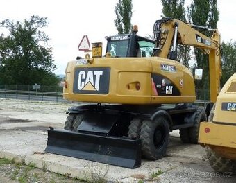 CATERPILLAR M313D - kolové rýpadlo