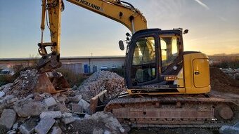 Pasovy bager new holland