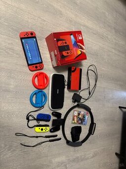 Nintendo Switch Oled Mario Red Edition + Ring Fit Adventure