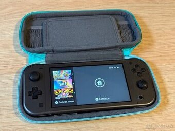 Nintendo Switch Lite - Obal / 64 GB karta