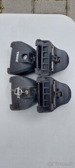 Predám úchyty Thule na strešné nosiče.Boli