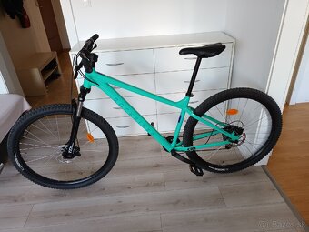 Rockrider EXPL 100 XL 29'' v svetlozelenéj farbe.