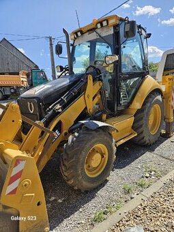Kolesovy nakladač bager Caterpillar 428E - 1