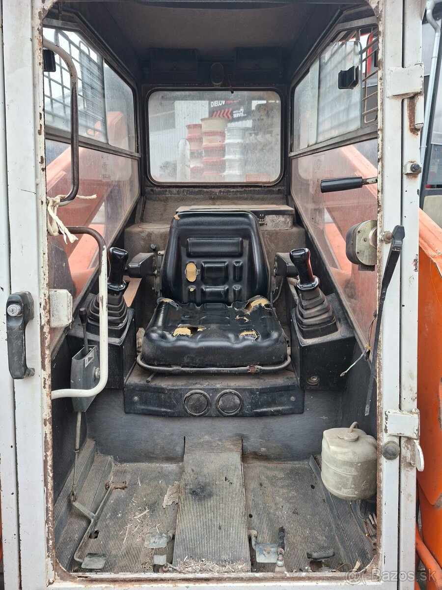 Predam Smykovy nakladac Unc locust 1203 - 2