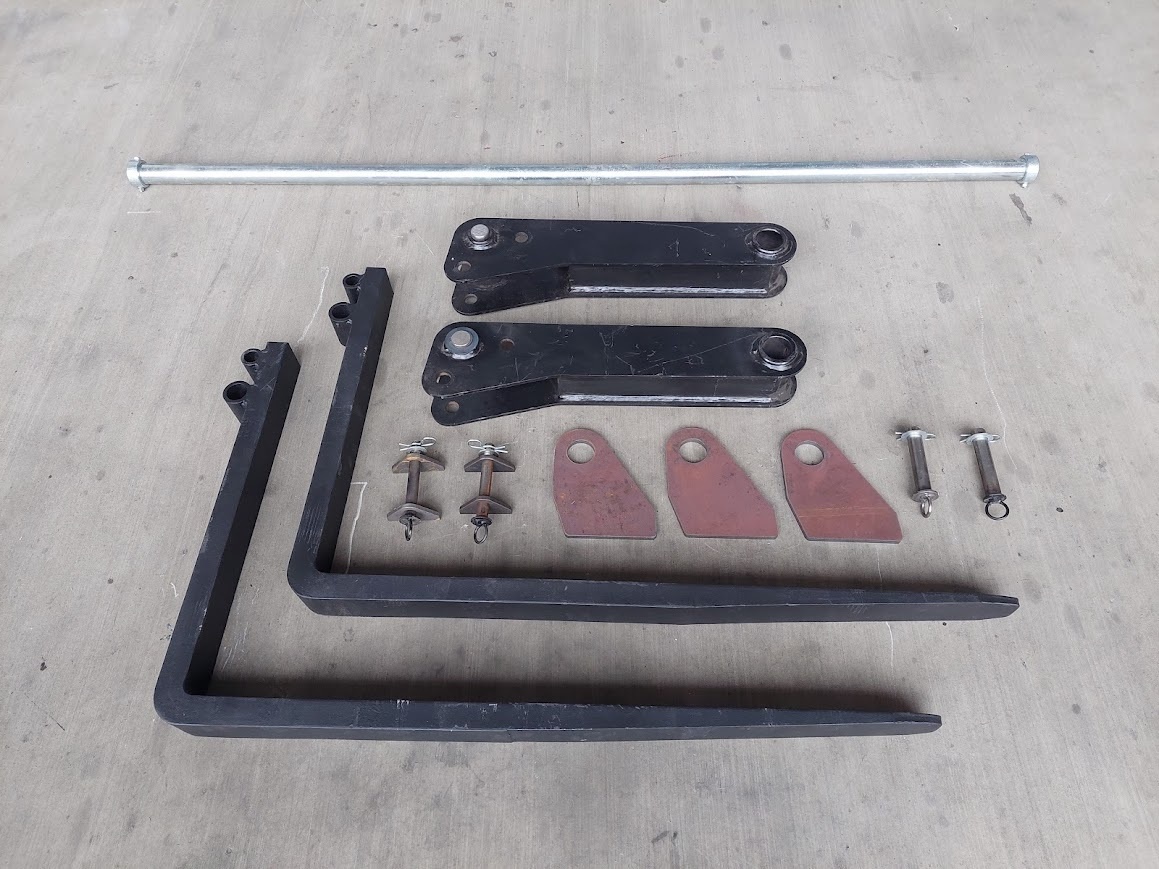 Preklápacie paletizačné vidly na traktorbager CAT a iné - 2