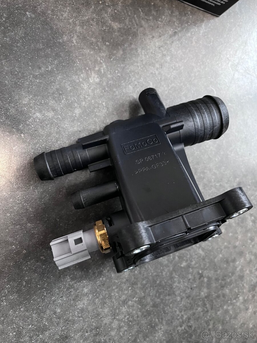 Obal termostatu,kryt OE Ford číslo CJ5E8K556AB,5198498 - 2