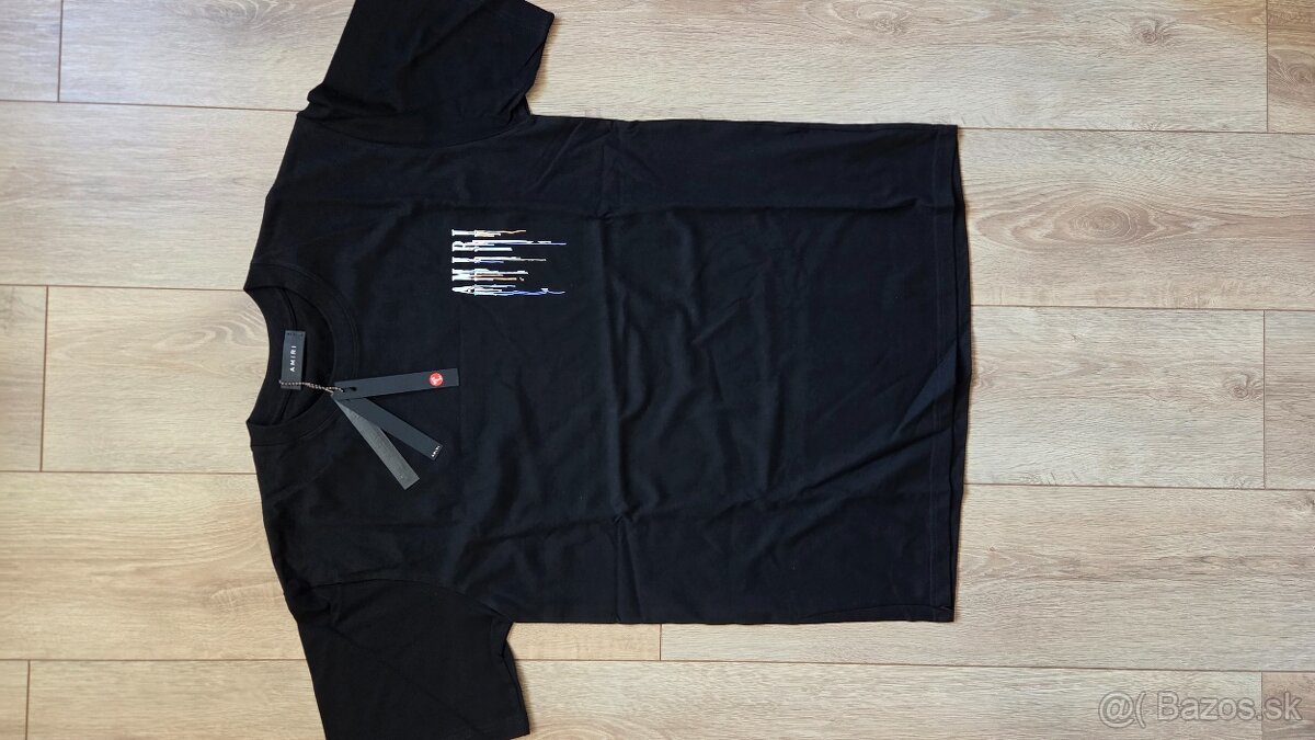 Amiri Paint Drip logo - 2