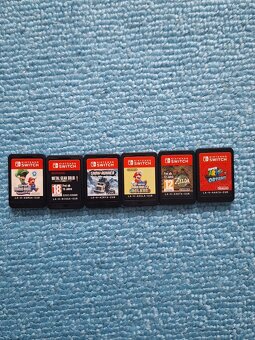 Nintendo Switch OLED + 7 hier + 2x Joy-Con + púzdro – stav a - 2
