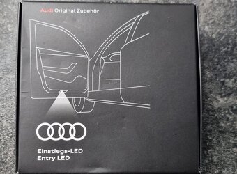 Audi podsvietenie dverí - 2