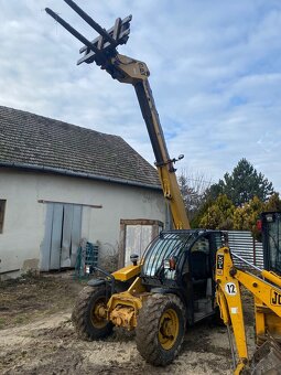 Manipulátor Caterpillar TH210 - 2