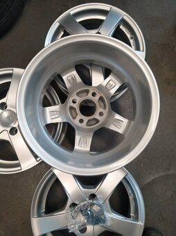 Alu 4 x 100 14' + letné pneu. - 2