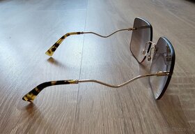 Slnečné okuliare Miu Miu. - 2
