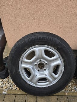 Predám disky na Daciu dasyer s pneumatikami 215-65R16 - 2