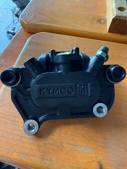 Nový brzdový strmeň KYMCO - 2