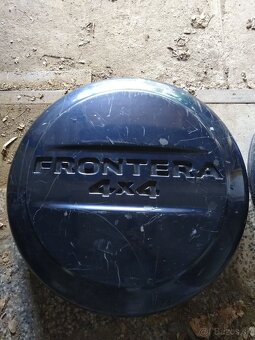 Opel Frontera kryt rezervy - 2