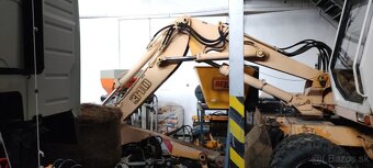 Kolesové rýpadlo Liebherr 310 - 2