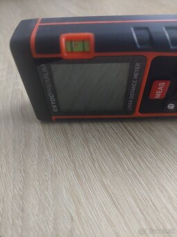 Laserorový diaľkomer (disto) značky Extol - 2