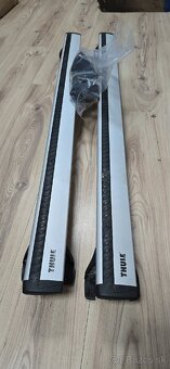 Priečinky a nosiče lyží (snowboardu) - 2