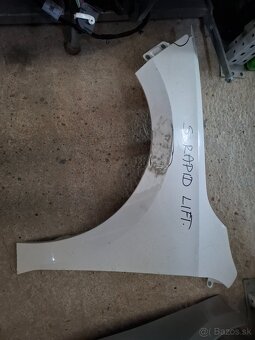 Škoda Rapid.  Blatník Lift - 2