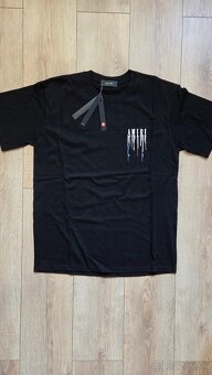 Amiri Paint Drip logo - 2