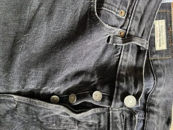 Čiierne rifle Levi’s Strauss W34 L34 gombíkové zapínanie - 2