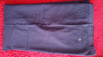 Panske tmavomodré nohavice : pás 102cm . - 2