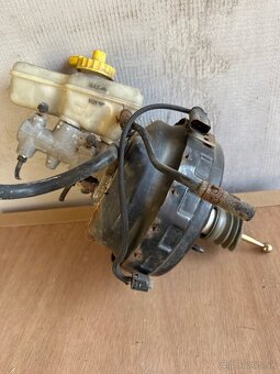 posilovač 1J2614105G - 2