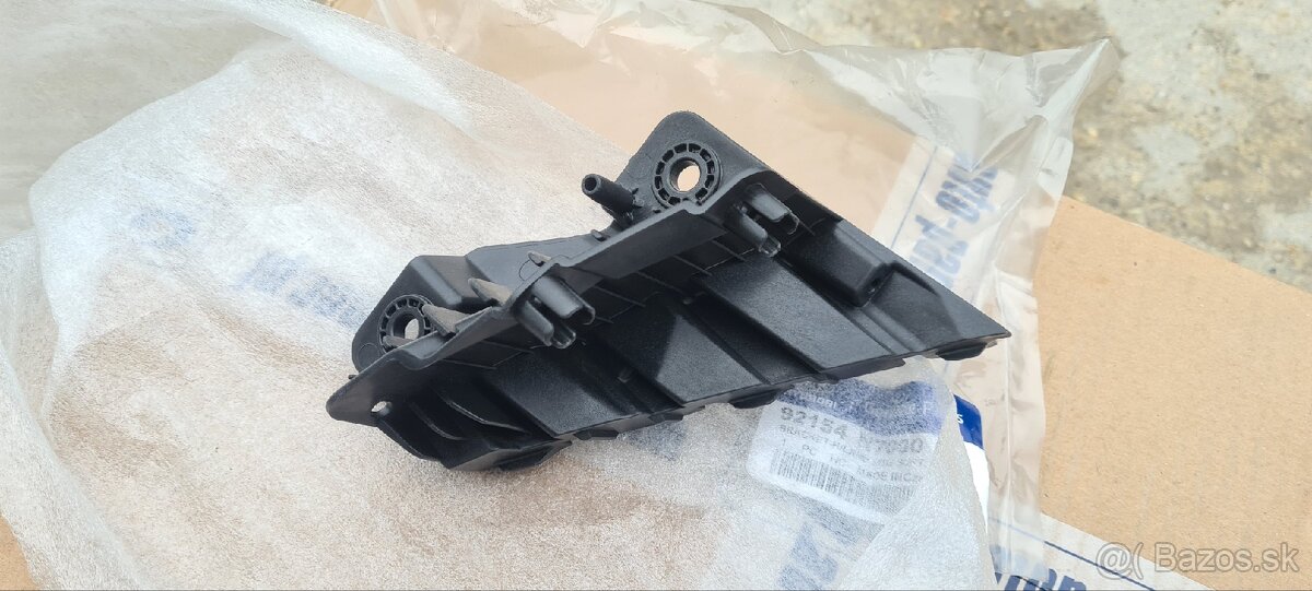 Držiak originál pravého svetla Hyundai Tucson nový P - 3