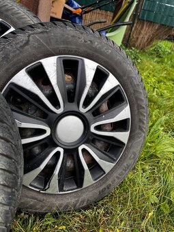 Oceľové disky R14 s puklicami a zimným pneu - 3