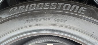 215-65-17 103V - Bridgestone- 4324- 6,7mm - top stav - 3
