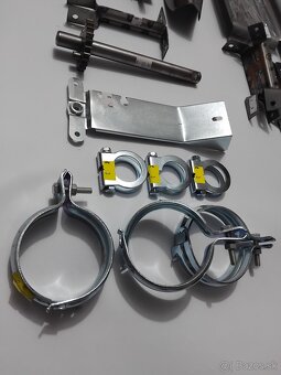 DIELY,SÚČIASTKY JAWA PIONIER 50 - OBJIMKA VÝFUKU STUPAČKY HT - 4