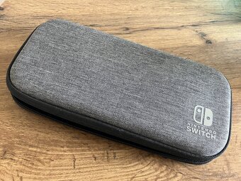 Nintendo Switch Lite + 4 hry - 4