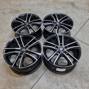 Hliníkové disky 5x114,3 R16 7J ET48 - 4