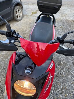 Sym CROX 125 - 4