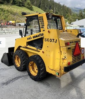 Šmykovy nakladač komatsu sk07j - 5