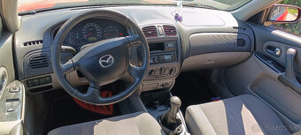 MAZDA 323, 1.5i 72kW 2002 - 5