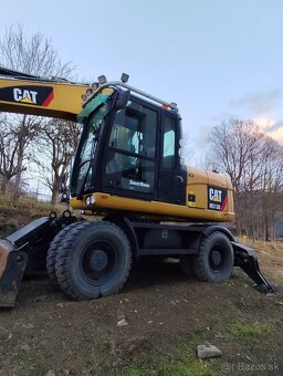 Caterpillar M313D kolesový bager - 5